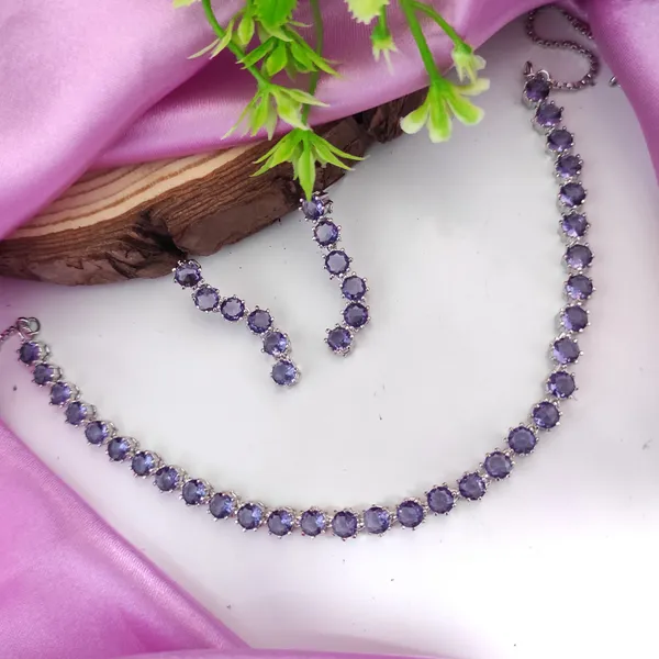 https://cdn-image.blitzshopdeck.in/ShopdeckCatalogue/tr:f-webp,w-600,fo-auto/6226f99c604c4a382408063a/media/Sonakshi_Purple_colour_american_diamond_necklace_with_pair_earring_BB61DXFKRL_2024-05-22_1.jpeg__Heera jewellers