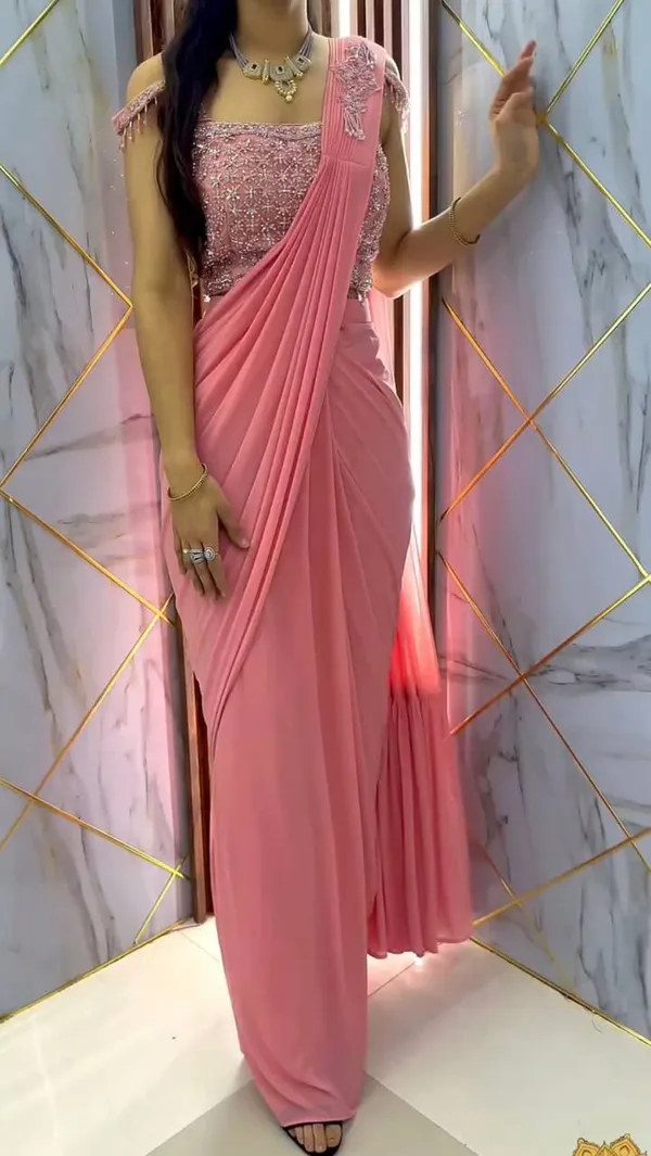 https://cdn-image.blitzshopdeck.in/ShopdeckCatalogue/tr:f-webp,w-600,fo-auto/6388899c38573bc3aa183595/media/Peach__Designer_Georgette_Ready_To_Wear_Saree_With_Ruffle_And_Patch_Work_And_Blouse__With_Thred_And_Sequence_work._7KMTS0QC9G_2024-01-27_1.jpg__Karm Fashion