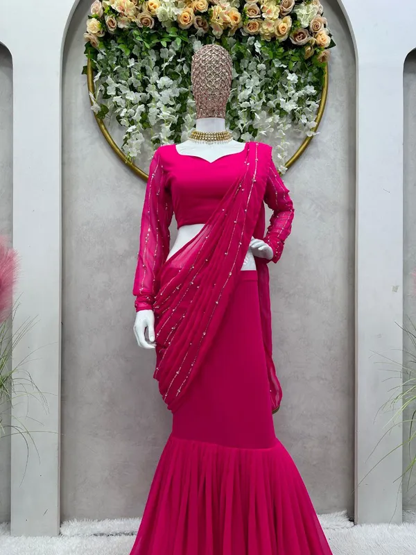 https://cdn-image.blitzshopdeck.in/ShopdeckCatalogue/tr:f-webp,w-600,fo-auto/6388899c38573bc3aa183595/media/Pink___Designer_Georgette_Reday_To_Wear_Lehengha__saree_On_Thread_With_Sequence_with_Rivet_Moti__Work_BFAUO22887_2023-12-09_1.jpg__Karm Fashion