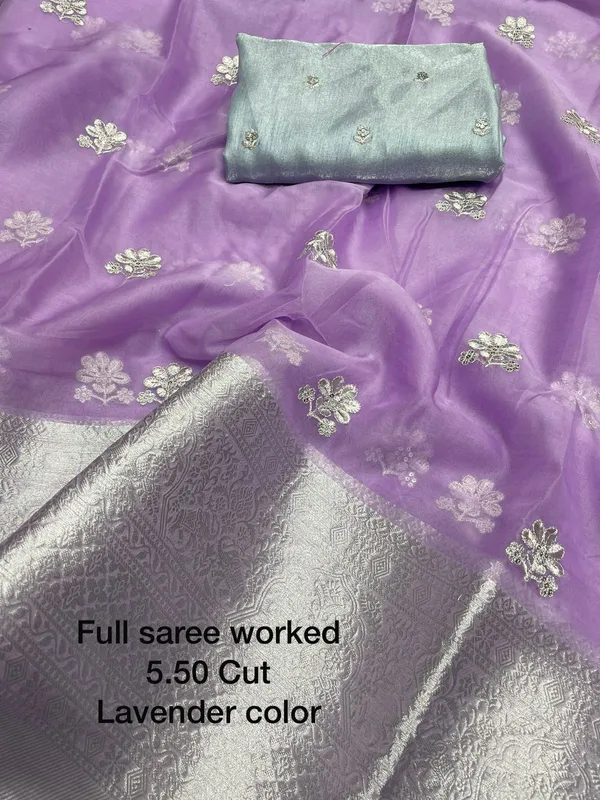 https://cdn-image.blitzshopdeck.in/ShopdeckCatalogue/tr:f-webp,w-600,fo-auto/63a6bebb3de9670012c21d63/media/Violet_Colored_Organza_Silk_Embroidered_Saree_With_Tassels__EL5XO8CNPK_2024-01-24_1.jpeg__Vinayak Textiles