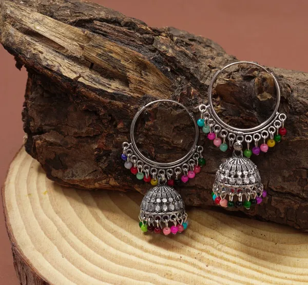 https://cdn-image.blitzshopdeck.in/ShopdeckCatalogue/tr:f-webp,w-600,fo-auto/6415958f1a426000122ef29a/media/AARNA_SILVER-PLATED_AD_STUDDED_JHUMKA_EARRINGS_LF4M56UA4Z_2024-02-19_1.jpg__Aarna Jewel