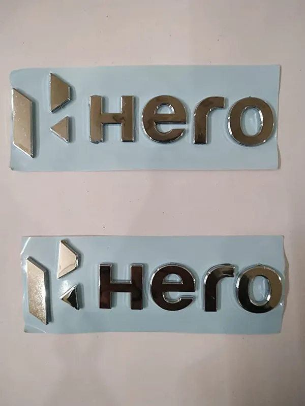 https://cdn-image.blitzshopdeck.in/ShopdeckCatalogue/tr:f-webp,w-600,fo-auto/64e31e1c279cee0014413fce/media/Hero_Tank_3D_Logo_for_Hero_Bikes_Hero_Logo_Metal_3D_Logo_AUTOPLEX_Emblem_for_Bike_Hero_Monogram__Standard_Size__Original_3D_Emblem_with_Chrome_Logo-Set__Splendor__WKS3ME6A2R_2023-09-23_1.jpg__ MAYJAI - Automotive Accessories