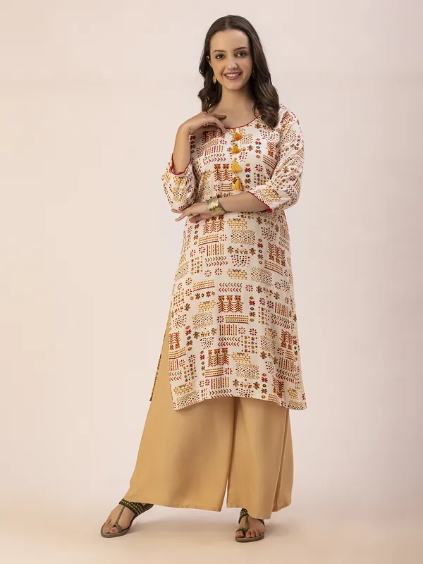 Off_White_Rayon_Women_Kurta,__Tribal_Inspired_Foil_Print_with_Tassels