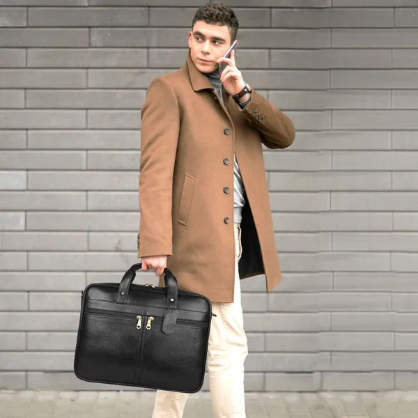 https://cdn-image.blitzshopdeck.in/ShopdeckCatalogue/tr:f-webp,w-600,fo-auto/650d483761d162b9ab23f8b2/media/Natural_Leather_Laptop_Briefcase_Messenger_Shoulder_Bags_for_Men_s_Office_16_inch_18_Liters_Capacity__Dimension_L_16_X_H_12_X_W_3_Inch___Weight_1_KG_1000_GR__8WUYK23GQG_2024-03-29_1.jpg