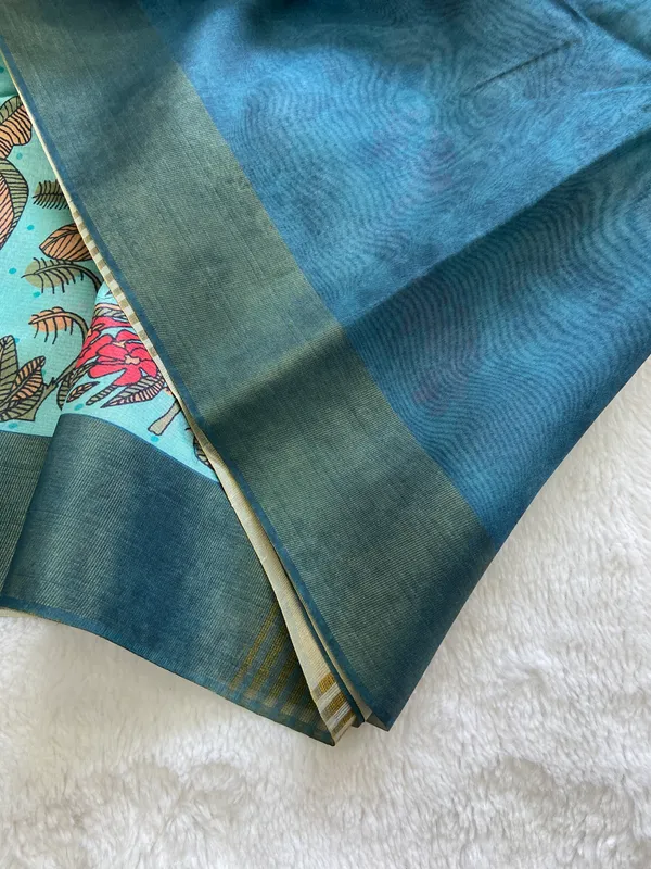 Jiya_Blue_&_Sky_Blue_–_Heartfelt_Festive_Season_Special_|_Soft_Tussar_Silk_Saree_with_Print,_Border_&_Contrast_Print_Blouse_with_Tassels