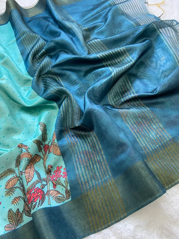 Jiya_Blue_&_Sky_Blue_–_Heartfelt_Festive_Season_Special_|_Soft_Tussar_Silk_Saree_with_Print,_Border_&_Contrast_Print_Blouse_with_Tassels