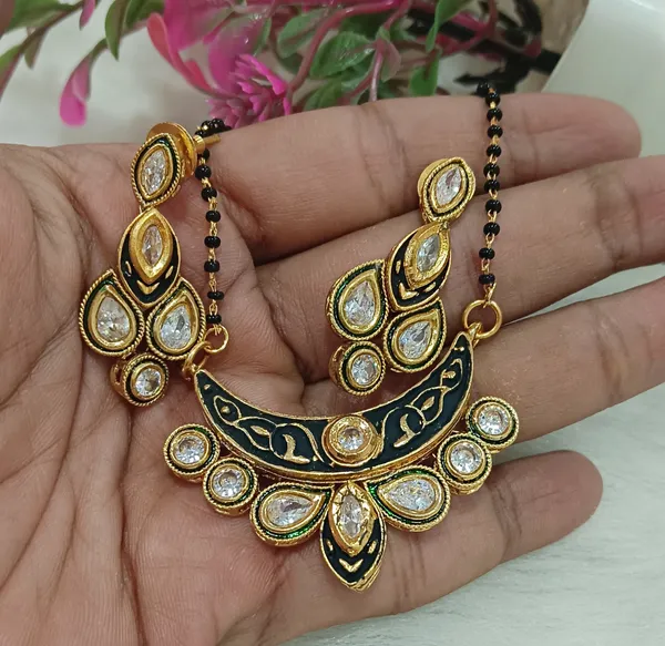 https://cdn-image.blitzshopdeck.in/ShopdeckCatalogue/tr:f-webp,w-600,fo-auto/655f446d02d8dc3ec146a77e/media/Beautiful_Polki_Kundan_CZ_Mangalsutra_Earrings_Set_MN3TZF3BKR_2024-05-16_1.jpg__Evy