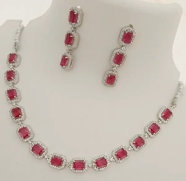 https://cdn-image.blitzshopdeck.in/ShopdeckCatalogue/tr:f-webp,w-600,fo-auto/655f446d02d8dc3ec146a77e/media/Premium_Quality_AAA_CZ_Ruby_Pink_Stones_Silver_Plated_Jewellery_Set_R9NOB2L9F5_2024-04-24_1.jpg__Evy