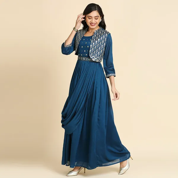 https://cdn-image.blitzshopdeck.in/ShopdeckCatalogue/tr:f-webp,w-600,fo-auto/6565c68d02d8dc3ec171d18d/media/Madhurams_Elegant_Blue_Silk_Embroidered_Gown:_A_Timeless_Blend_of_Comfort_and_Style_6GV5TCUK2Y_2024-02-20_1.jpg__Madhuram Textile