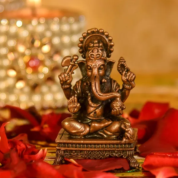 Decor_Copper_Handmade_Small_Ganesha_2.4_inches_Sitting_Idol_Statue_Showpiece_for_Home_Temple_Decor_II_Car_Dashboard_Decor_II_Office_Desk_II_Nice_Gift_Ideal_for_Good_Luck_Wishes_II
