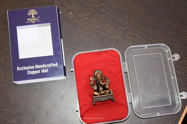 Decor_Copper_Handmade_Small_Ganesha_2.4_inches_Sitting_Idol_Statue_Showpiece_for_Home_Temple_Decor_II_Car_Dashboard_Decor_II_Office_Desk_II_Nice_Gift_Ideal_for_Good_Luck_Wishes_II