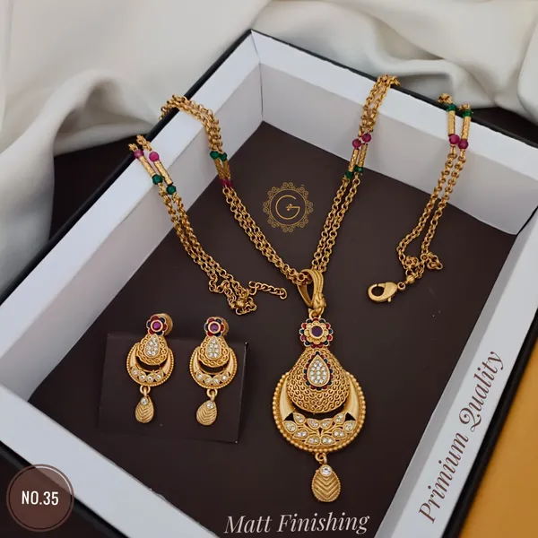https://cdn-image.blitzshopdeck.in/ShopdeckCatalogue/tr:f-webp,w-600,fo-auto/65784ce6785657b57c9b5ccb/media/Traditional_Design_Copper_Micro_Gold_Plated_Mala_Chain_Pendant_With_Earrings_Set_For_Women_And_Girls_ISYTSQ8831_2024-03-19_1.jpg__Grisha Jewellery