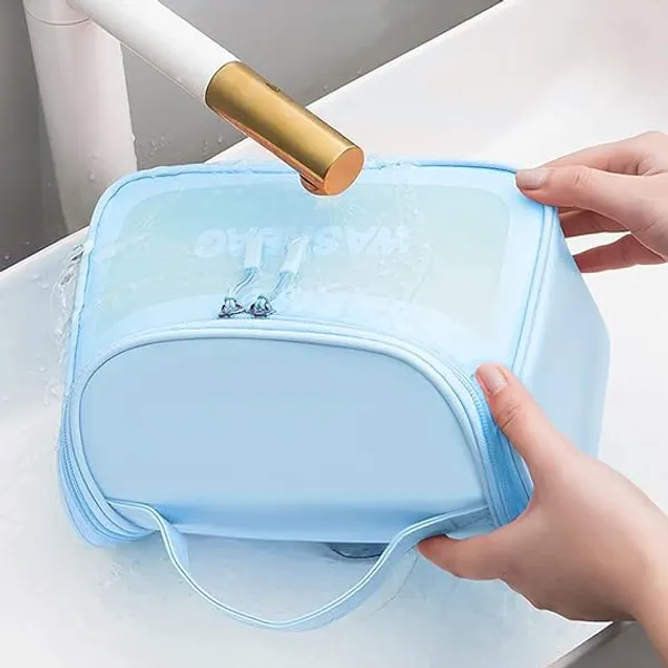 https://cdn-image.blitzshopdeck.in/ShopdeckCatalogue/tr:f-webp,w-600,fo-auto/658e52526eee22624179fb1e/media/Multi_Functional_Large_Makeup_Pouch_for_Women___Waterproof_PVC_Cosmetic_Bags_with_Hook_for_Girls___Toiletry_Storage_Wash_Bag___Travel_Organizer_for_Bath_Accessories___Grooming_Kit___Blue_7USBUPFCR0_2024-04-18_1.jpg__VASTRABAZAR