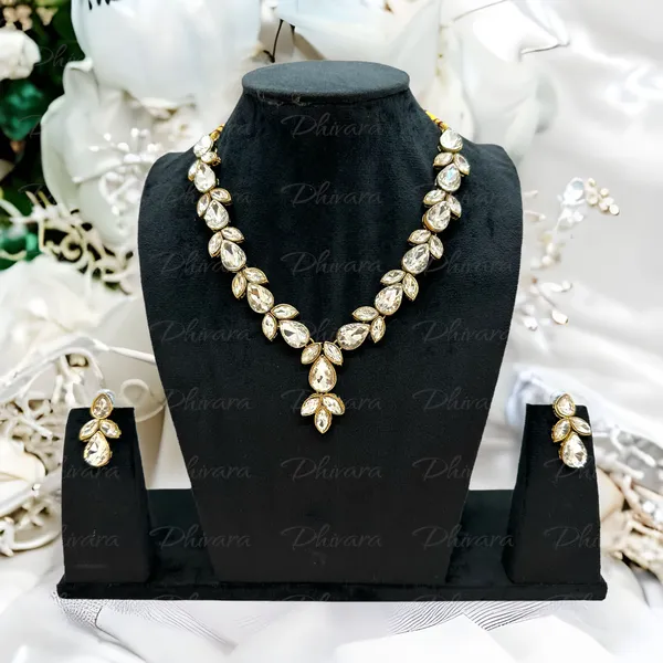 https://cdn-image.blitzshopdeck.in/ShopdeckCatalogue/tr:f-webp,w-600,fo-auto/65b7523602d8dc3ec1da33d5/media/Dhivara_Stylish_Copper_Plated_Twinkling_Leaves_Necklace_PMVO86GDAP_2024-05-15_1.PNG__DHIVARA