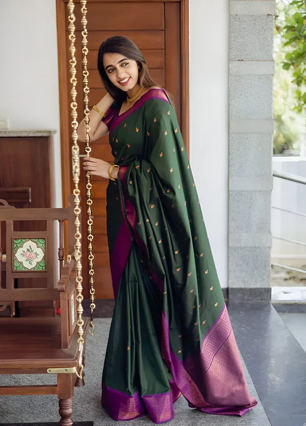 https://cdn-image.blitzshopdeck.in/ShopdeckCatalogue/tr:f-webp,w-600,fo-auto/65e1b534eddd14767aed70e6/media/GORGEOUS_DARK_GREEN_COLORED_SAREE_FOR_WOMEN_66RAE6GXC8_2024-04-20_1.jpeg__Aura Silk