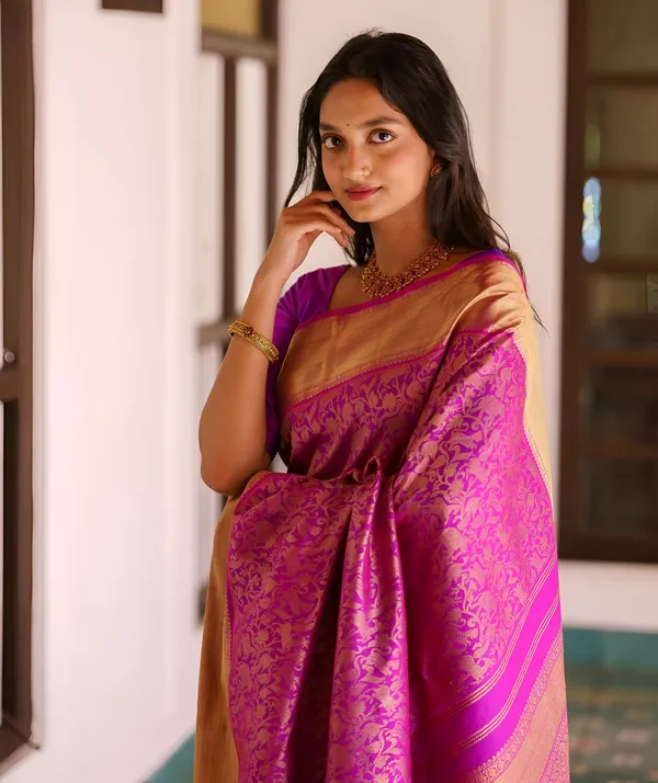 https://cdn-image.blitzshopdeck.in/ShopdeckCatalogue/tr:f-webp,w-600,fo-auto/65e1b534eddd14767aed70e6/media/Pinkish_Purple_Kanjivaram_Silk_Saree__0MR2QR1UYH_2024-05-19_1.jpeg__Aura Silk