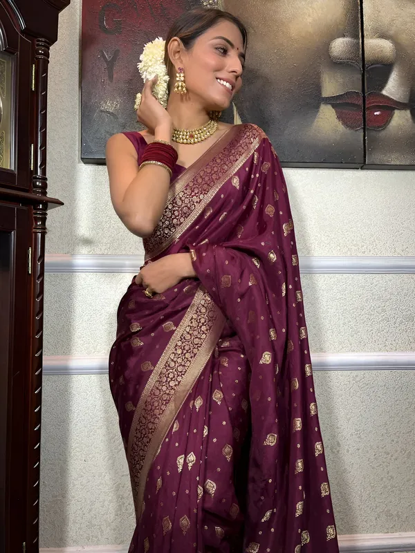 https://cdn-image.blitzshopdeck.in/ShopdeckCatalogue/tr:f-webp,w-600,fo-auto/65e1b534eddd14767aed70e6/media/Plum_Wine_Banarasi_Silk_Saree_with_Unstitched_Blouse_BW6JU9HTV4_2024-05-20_1.jpeg__Aura Silk