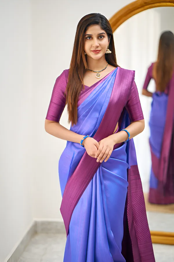 https://cdn-image.blitzshopdeck.in/ShopdeckCatalogue/tr:f-webp,w-600,fo-auto/65e1b534eddd14767aed70e6/media/Thunder_Blue_And_Magenta_Color_Fancy_Saree_WUJ9NVA6V5_2024-04-18_1.png__Aura Silk