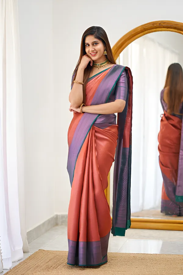 https://cdn-image.blitzshopdeck.in/ShopdeckCatalogue/tr:f-webp,w-600,fo-auto/65e1b534eddd14767aed70e6/media/Tomato_Red_And_Purple_Color_Classic_Silk_Saree_1HUY1PU4LB_2024-04-18_1.png__Aura Silk