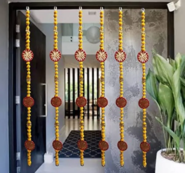 Handmade_Wall_Door_5_ft.Strings_Hanging_Pom_Pom_Torans_Garland_Bandhwar_with_Golden_Bells_Decoration_Item_for_Home_DecorDiwali_Festival,Navratri,Wedding_(5_FT_6_Strings)_YellowRed