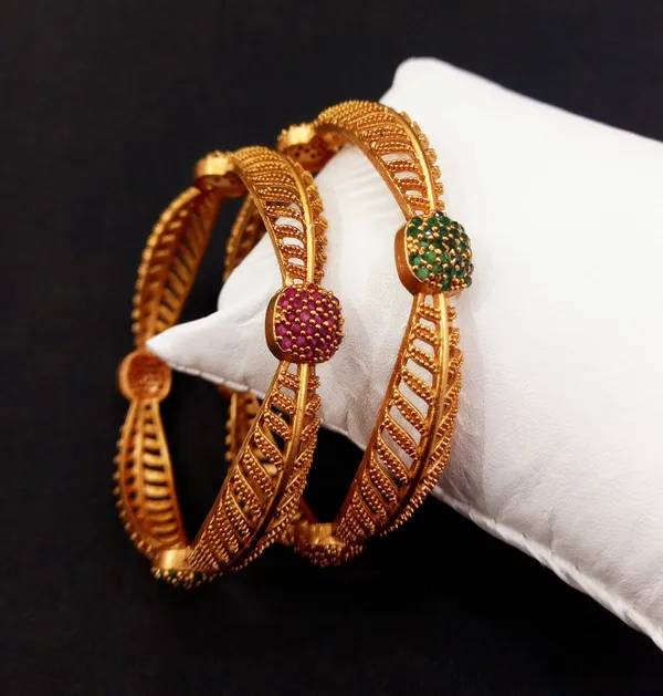 https://cdn-image.blitzshopdeck.in/ShopdeckCatalogue/tr:f-webp,w-600,fo-auto/65eedd7726f0963ed837c9bf/media/Mystic_Oasis__Set_of_2_South_Indian_Bangles_with_Ruby_and_Green_Stones_ZV0Y6VVZTK_2024-04-09_1.jpg__Bajaj Gold