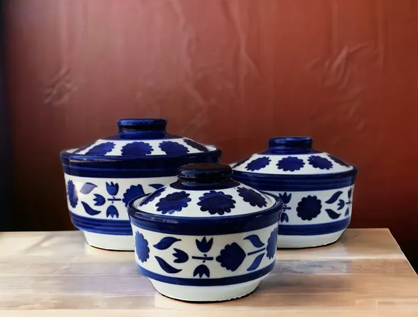 https://cdn-image.blitzshopdeck.in/ShopdeckCatalogue/tr:f-webp,w-600,fo-auto/65fc37fa02d8dc3ec18ca262/media/MADARKS_Handpainted_Ceramic_Serving_Donga_with_Lid_Casserole_Set__Set_of_3__White_and_Blue____Dinner_Serving_Set___DEAC31D5FW_2024-03-30_1.jpg__Madarks