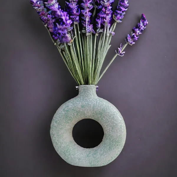 https://cdn-image.blitzshopdeck.in/ShopdeckCatalogue/tr:f-webp,w-600,fo-auto/65fc37fa02d8dc3ec18ca262/media/Madarks_Ceramic_Donut_Vase__Flower_Vase_Pampas_Grass_Vase__Color__Light_Green__Bedroom__Dining_Table__Size__6_Inch__0DG2LUL7T6_2024-03-29_1.jpg__Madarks