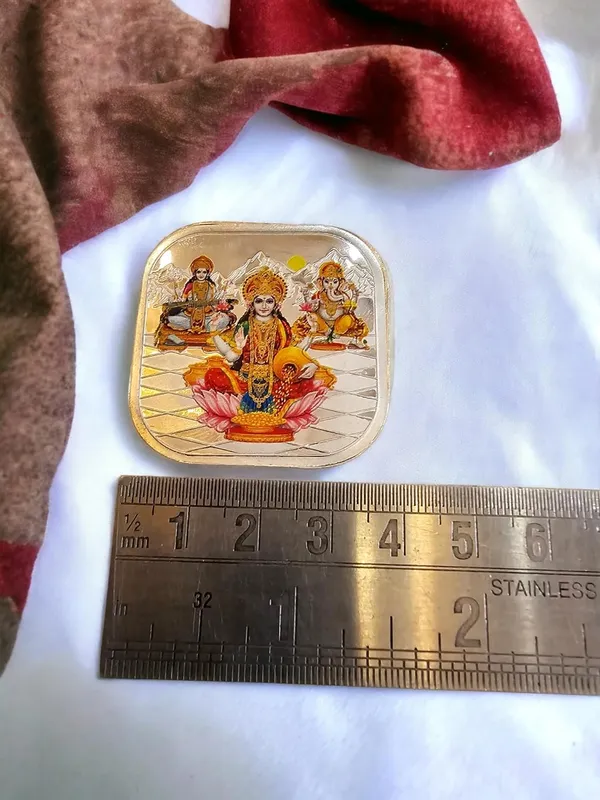 Silver_999_Purity_Hallmark_Coin,_Colorfull_Laxmi_Ganesh_Saraswati_Trimoorti_Coin_For_Diwali_(10_Gm_999)