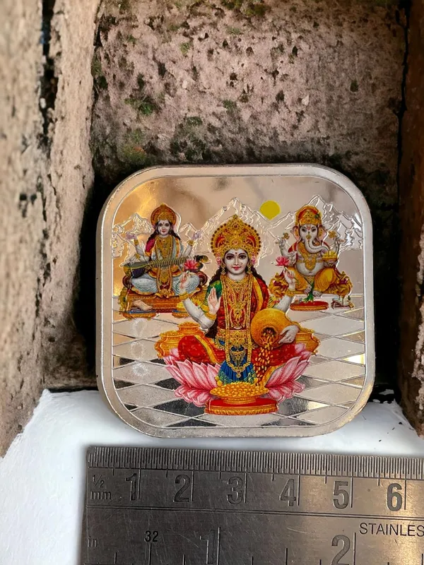 Silver_999_Purity_Hallmark_Coin,_Colorfull_Laxmi_Ganesh_Saraswati_Trimoorti_Coin_For_Diwali_(20_Gm_999)