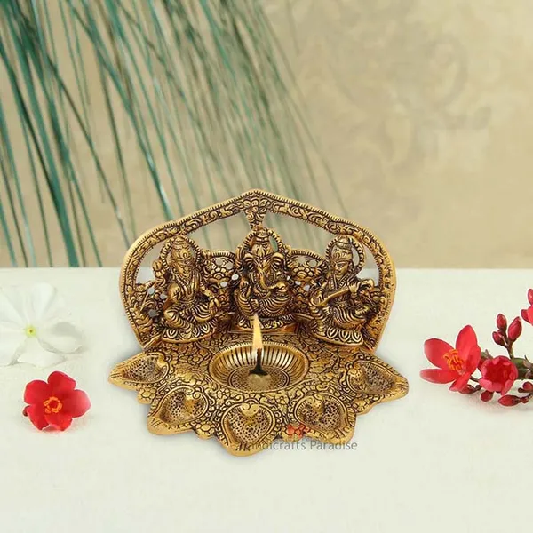 Golden_Metal_Lakshmi,_Ganesh_And_Saraswati_Seated_Figurine_Diya,_4.5_Inch