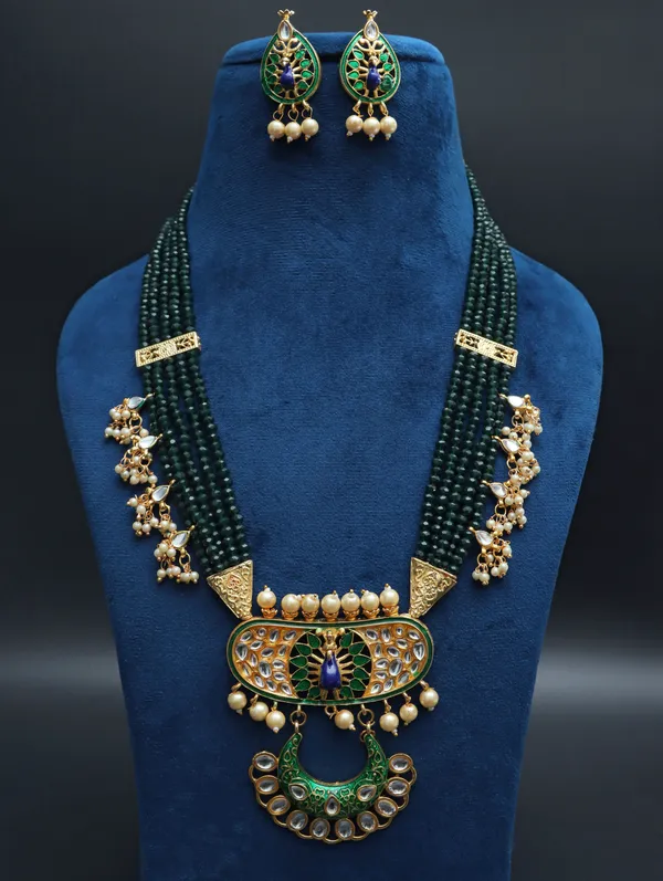 OZANOO Dark Green Long Kundan Peacock Necklace Set With Earrings Price in India Buy OZANOO Dark Green Long Kundan Peacock Necklace Set With Earrings online at undefined