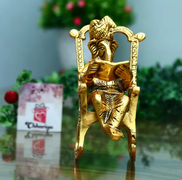 Golden_Metal__Lord_Ganesha_Reading_Ramayana_Statue_Hindu_Ganesh_Ganpati_Sitting_On_Chair_With_Kuber_Diya_Idol_Sculpture_For_Home_Office_And_Gifts_Decor
