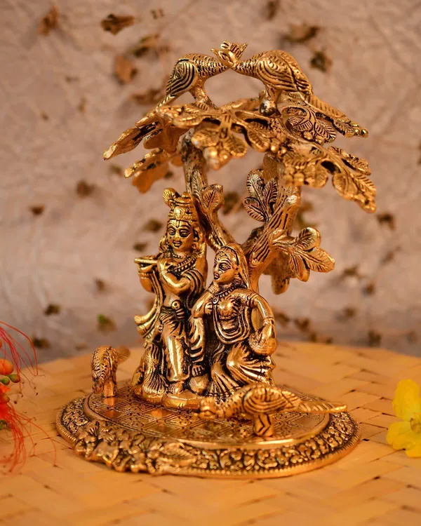 Golden_Metal_Radha_Krishna_Sitting_Under_Tree_Plying_Flute_Decorative_Showpiece