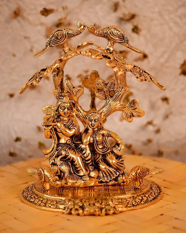 Golden_Metal_Radha_Krishna_Sitting_Under_Tree_Plying_Flute_Decorative_Showpiece