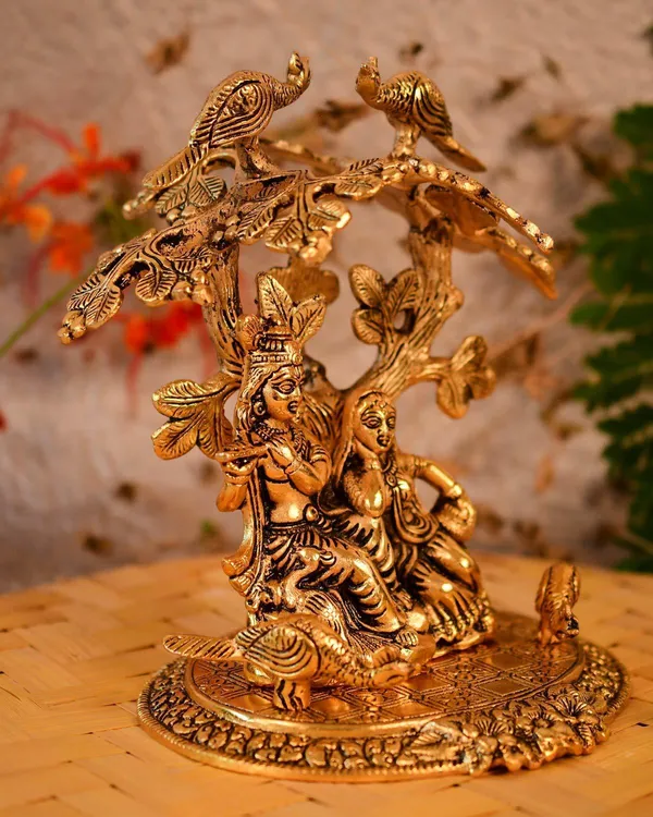 Golden_Metal_Radha_Krishna_Sitting_Under_Tree_Plying_Flute_Decorative_Showpiece